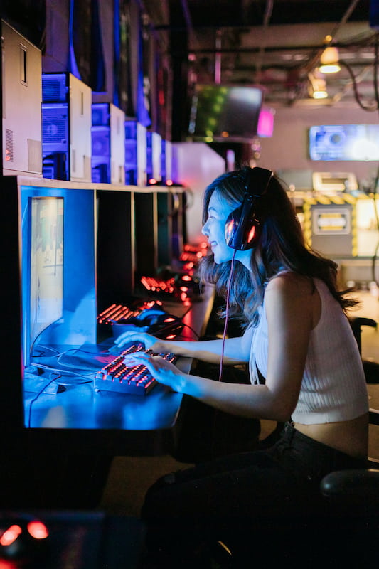 woman playing a video game on a computer